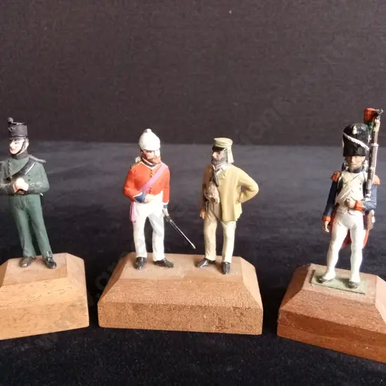 4 CAST SOLDIER MODELS MOUNTED ON 3 WOODEN BLOCKS