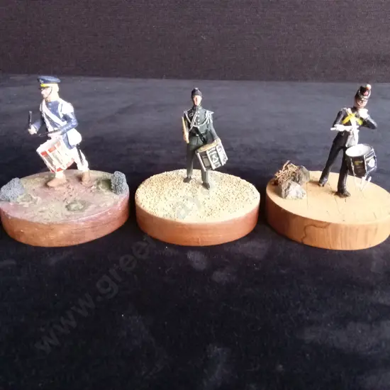 3 CAST SOLDIER MODELS MOUNTED ON ROUND WOODEN BLOCKS UNBRANDED