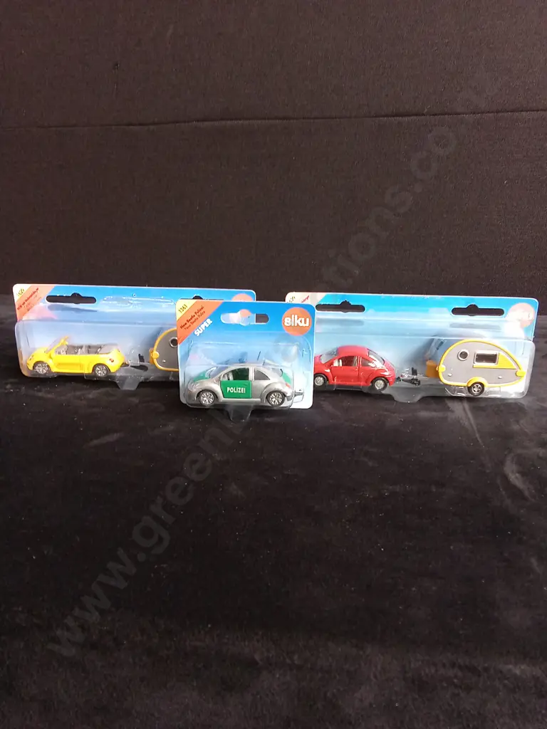 3 1:64 SCALE SIKU VOLKSWAGEN BEETLE AND BEETLE + CARAVAN MODELS, BOXED Image 1++