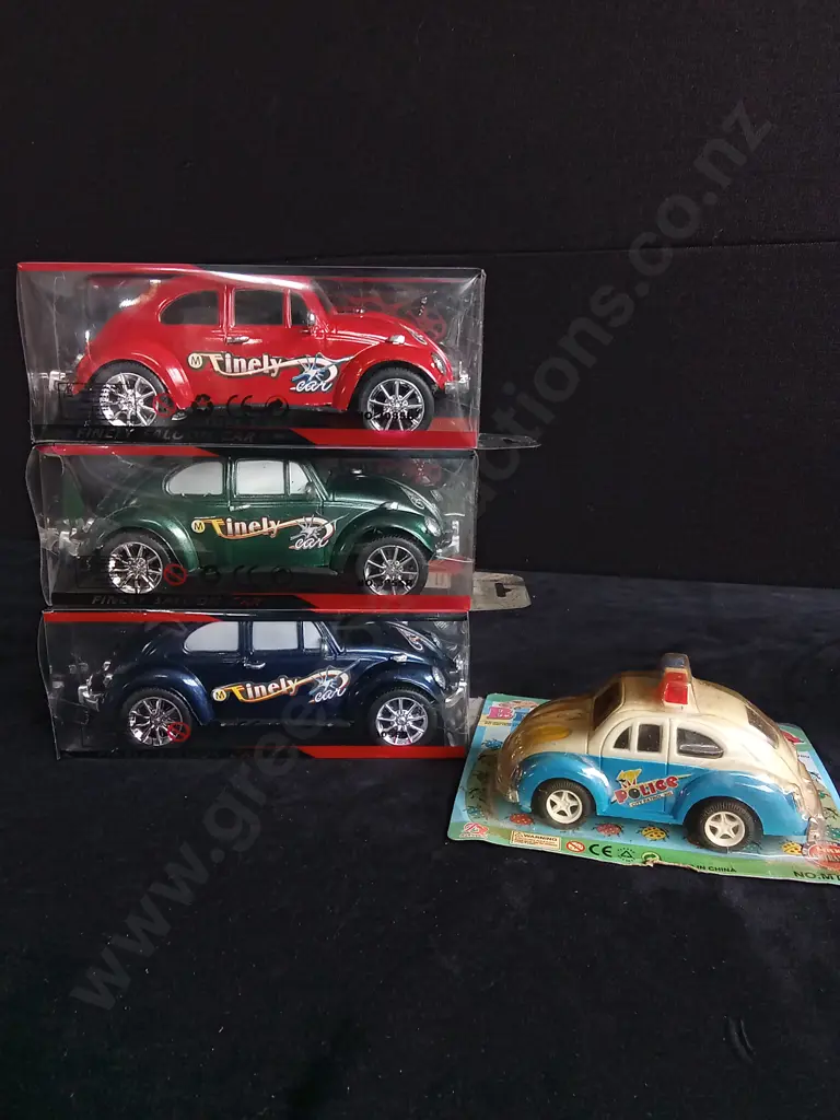 4 TOY CARS, PACKAGED Image 1++
