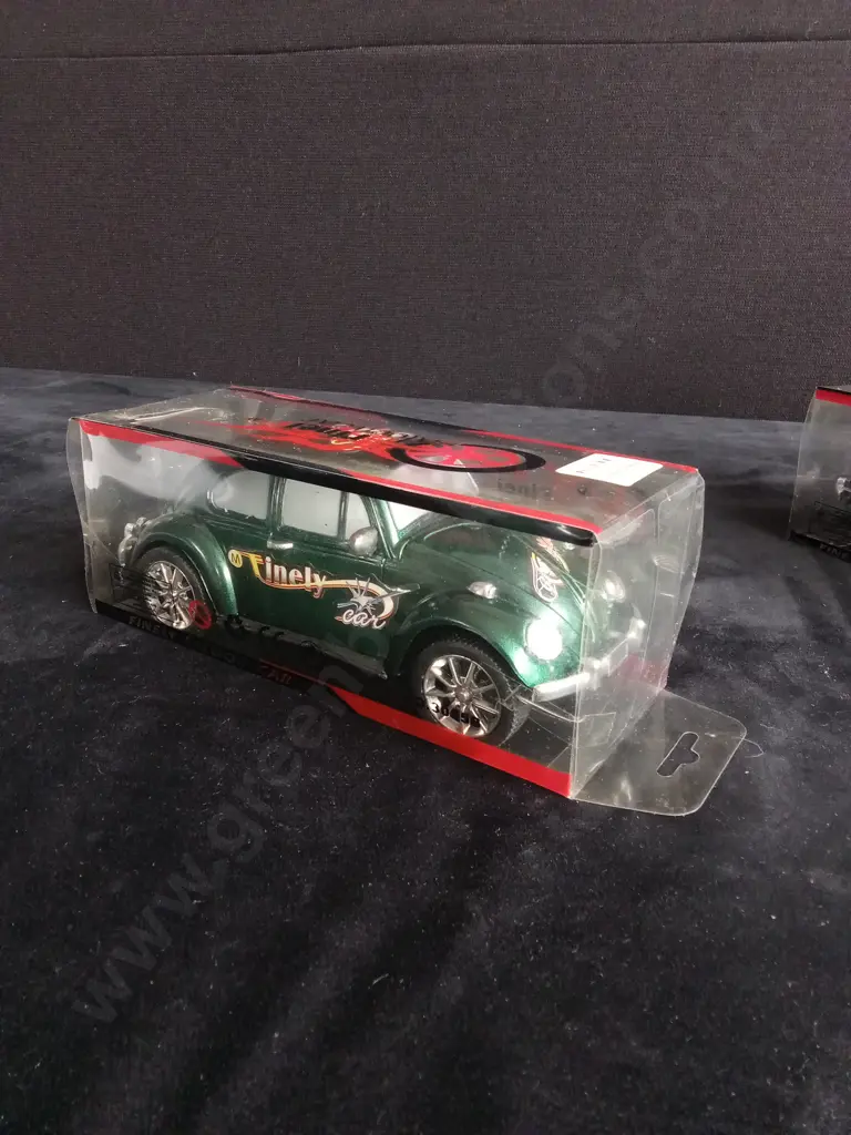 4 TOY CARS, PACKAGED Image 1++