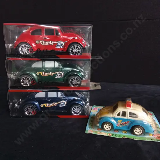 4 TOY CARS, PACKAGED