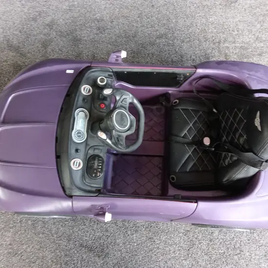 CHILDRENS PURPLE RIDE ON CAR