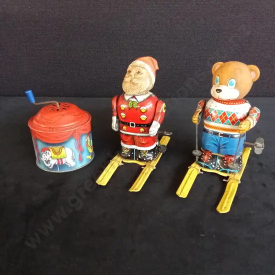 VINTAGE JAPANESE TIN WIND-UP TOYS SANTA CLAUS AND SKIER BEAR WITH A BOLZ CAROUSEL MUSIC BOX