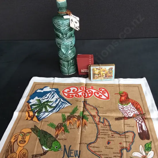 KIWIANA TEATOWEL PLAYING CARDS AND A TI-TOKI LIQUOR BOTTLE