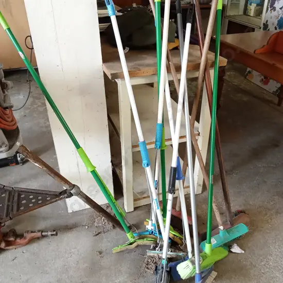 COLLECTION OF BROOMS AND MOPS