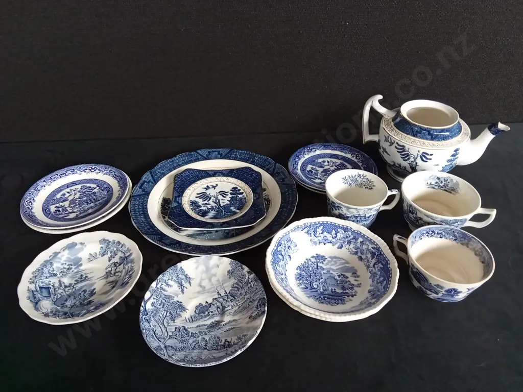 COLLECTION OF BLUE AND WHITE ILLUSTRATED PLATES CUPS AND TEAPOT Image 1++