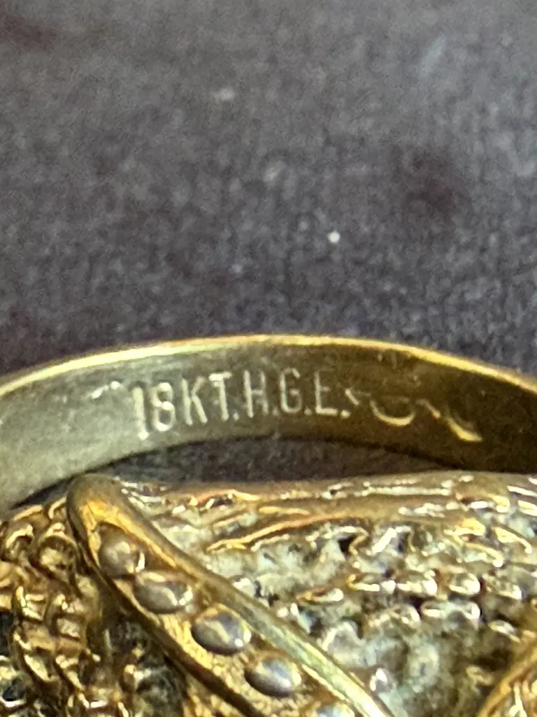 GOLD RING MARKED 18K WITH ONE EYE STONE MISSING Image 1++
