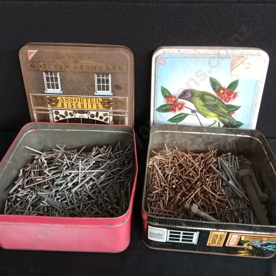 TWO BISCUIT TINS FULL OF NAILS